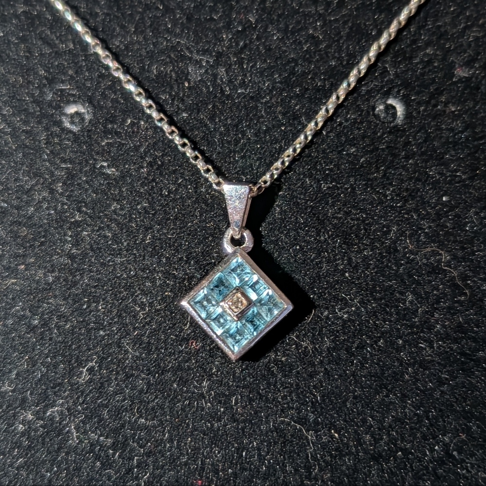 Elegant Silver and Blue Topaz Pendant Necklace